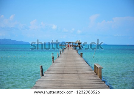 Couple Walking on Wooden Pier in Sunny Day