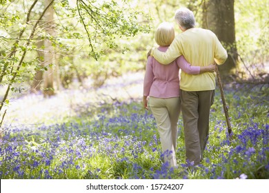 Couple Walking Outdoors With Walking Stick