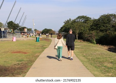 A Couple Walking In Guaíba Park In The City Of Porto Alegre, Brazil.