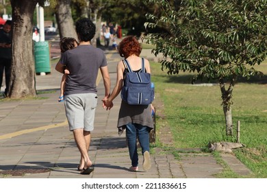 A Couple Walking In Guaíba Park In The City Of Porto Alegre In Brazil.
