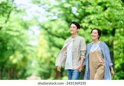 Couple walking in the park in early summer - Powered by Shutterstock