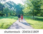 A couple walking in the Piedmont Park in Atlanta at daylight