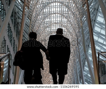Couple Walking up Stairs
