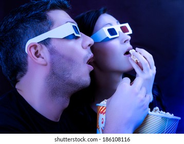 Couple Watching Action Movie In Cinema