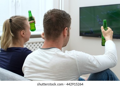 Couple Watching American Football On Tv.