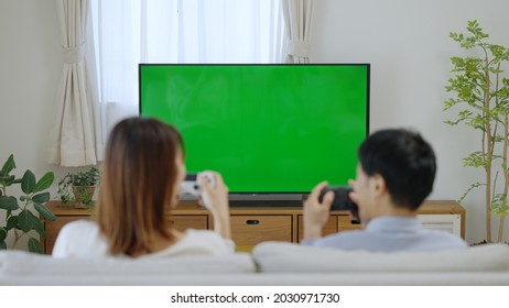 A Couple Watching Chroma Key TV