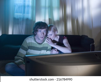 A Couple Watching A Horror Movie.