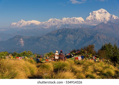 Couple watching the Mt. Dhaulagiri (8,172m) from Poon Hill, Nepal.
