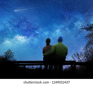 Couple Watching The Stars In Night Sky