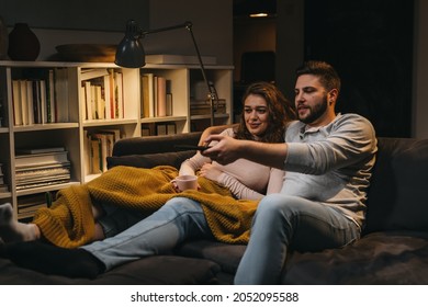 Couple Watching Television At Home