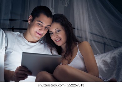 Couple Watching A Video On Their Tablet Computer