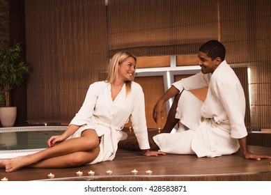 Couple Wearing Bathrobe Enjoying Day At The Spa.