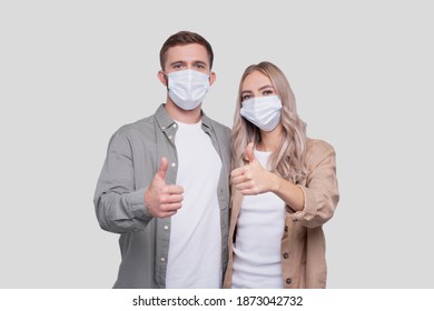 Couple Wearing Medical Mask Showing Thumb Up Isolated. Man And Woman Hugging, Lovers, Friends, Couple, Virus Concept