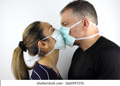 Couple Wearing A Virus Face Mask Kissing Concept For Corona Virus 