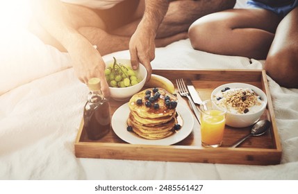 Couple, wellness or hands for breakfast in bed for morning, brunch or food snack together to relax in home. Valentines day, wake up or people eating for healthy diet, nutrition or orange juice - Powered by Shutterstock