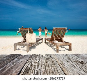 Couple in white relax on a tropical beach at Maldives - Shutterstock ID 286173719