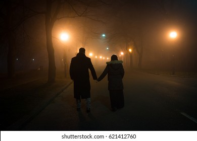 Couple Wife And Husband Walking Down The Night Street