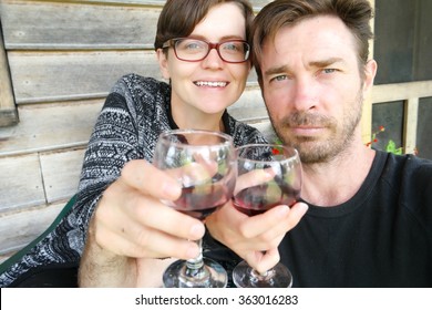 couple wine selfie farmstay holiday tasmania - Powered by Shutterstock