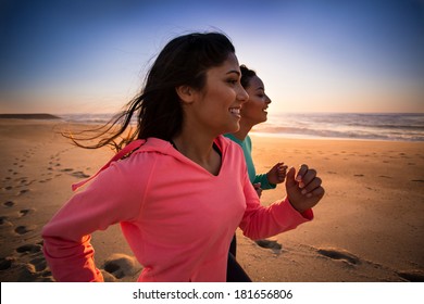 Couple of women running and walking on the beach - Powered by Shutterstock