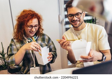 Couple Working At Home Eating Chinese Food Ordered Online.