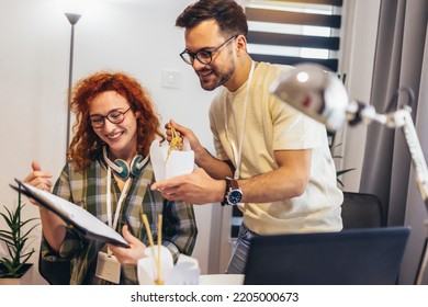 Couple Working At Home Eating Chinese Food Ordered Online.