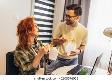 Couple Working At Home Eating Chinese Food Ordered Online.