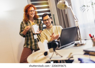 Couple Working At Home Eating Chinese Food Ordered Online.