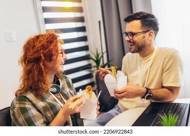 Couple Working At Home Eating Chinese Food Ordered Online.