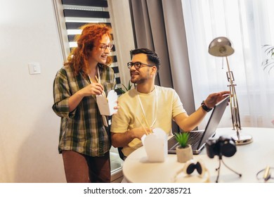 Couple Working At Home Eating Chinese Food Ordered Online.