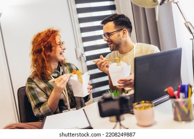 Couple Working At Home Eating Chinese Food Ordered Online.