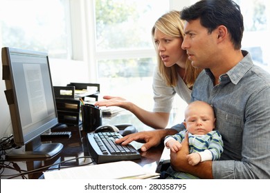 Couple working in home office with baby - Powered by Shutterstock