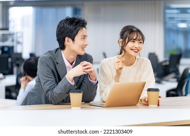 Couple of young Asian people meeting in casual office. - Powered by Shutterstock