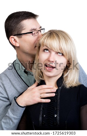 Similar – Young couple kissing in a studio portrait