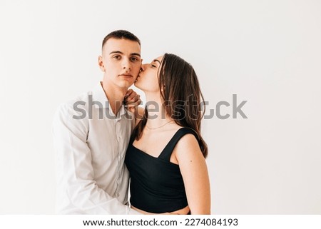 Couple young woman and man kissing lifestyle emotional portrait