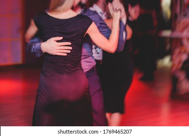 Couples Dancing Argentinian Dance Milonga In The Ballroom, Tango Lesson In The Red Lights, Dance Festival