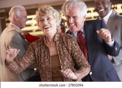 Couples Dancing Together At A Nightclub