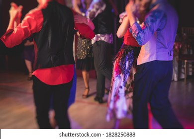 Couples Dancing Traditional Latin Argentinian Dance Milonga In The Ballroom, Tango Salsa Bachata Lesson In The Red Lights, Dance Festival
