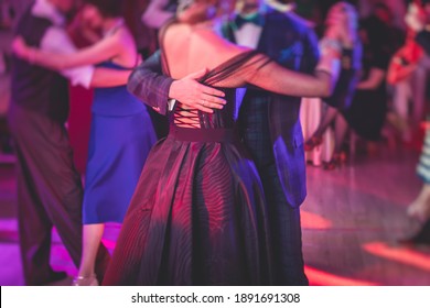 Couples Dancing Traditional Latin Argentinian Dance Milonga In The Ballroom, Tango Salsa Bachata Kizomba Lesson In The Red Lights, Dance Festival 