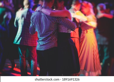 Couples Dancing Traditional Latin Argentinian Dance Milonga In The Ballroom, Tango Salsa Bachata Kizomba Lesson In The Red Lights, Dance Festival 