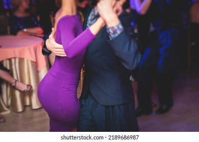 Couples Dancing Traditional Latin Argentinian Dance Milonga In The Ballroom, Tango Salsa Bachata Kizomba Lesson In The Red And Purple Lights, Dance Festival
