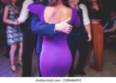 Couples Dancing Traditional Latin Argentinian Dance Milonga In The Ballroom, Tango Salsa Bachata Kizomba Lesson In The Red And Purple Lights, Dance Festival
