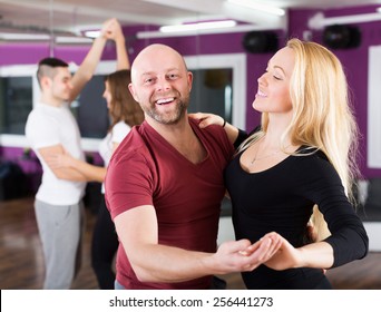 Couples Enjoying Of Partner Dance And Smiling Indoor