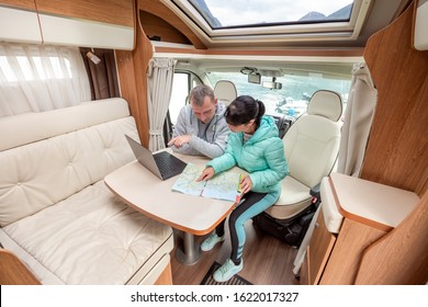 Couples in RV Camper looking at the local map for the trip. Family vacation travel, holiday trip in motorhome, Caravan car Vacation. - Powered by Shutterstock