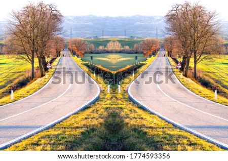 Couples Walking In A Country Street On Asphalt At Sunset, Green And Yellow Meadows, surreal specular countryside view