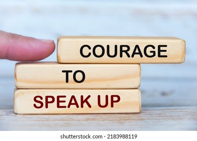 Courage To Speak Up Text On Wooden Blocks. Business Culture Concept