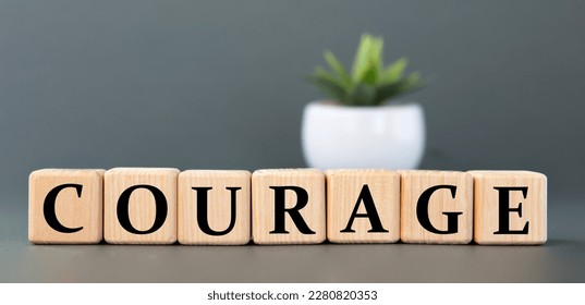 COURAGE - word on wooden cubes on a gray background with a cactus. Info concept - Shutterstock ID 2280820353