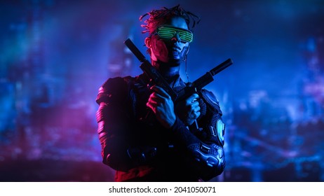 A courageous cyberpunk warrior fights with guns in his hands against the backdrop of the night city of the future. Cyberpunk concept. Game, virtual reality. 
