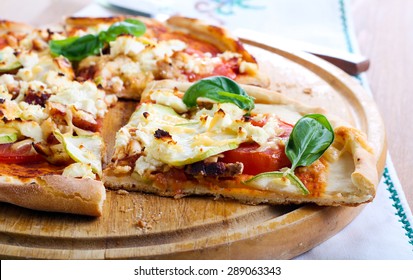 Courgette, Chicken And Feta Pizza On Board