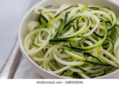 Courgette Noodles In Bowl On Gray Ceramic Background