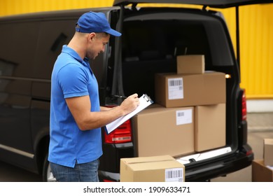 Courier With Clipboard Near Delivery Van Outdoors